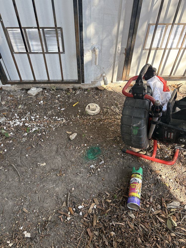 Drain cleaning equipment positioned at an outdoor cleanout